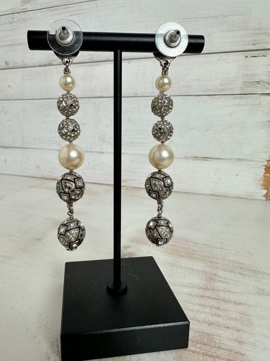 Chanel 2014C Silver toned and rhinestone dangle earrings adorned- pierced