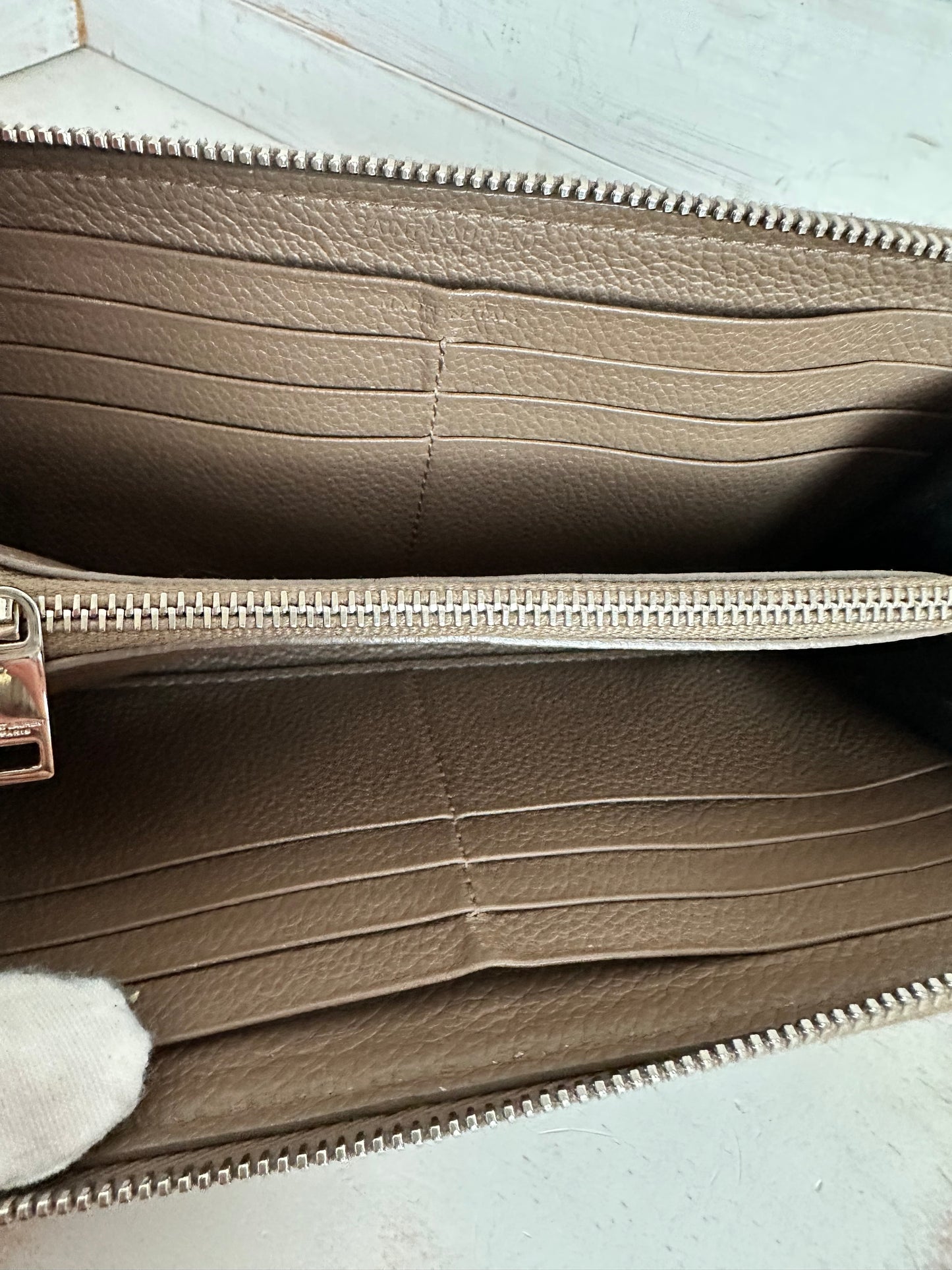 YVES SAINT LAURENT
Taupe Pebbled Leather Rive Gauche Zip Around Wallet