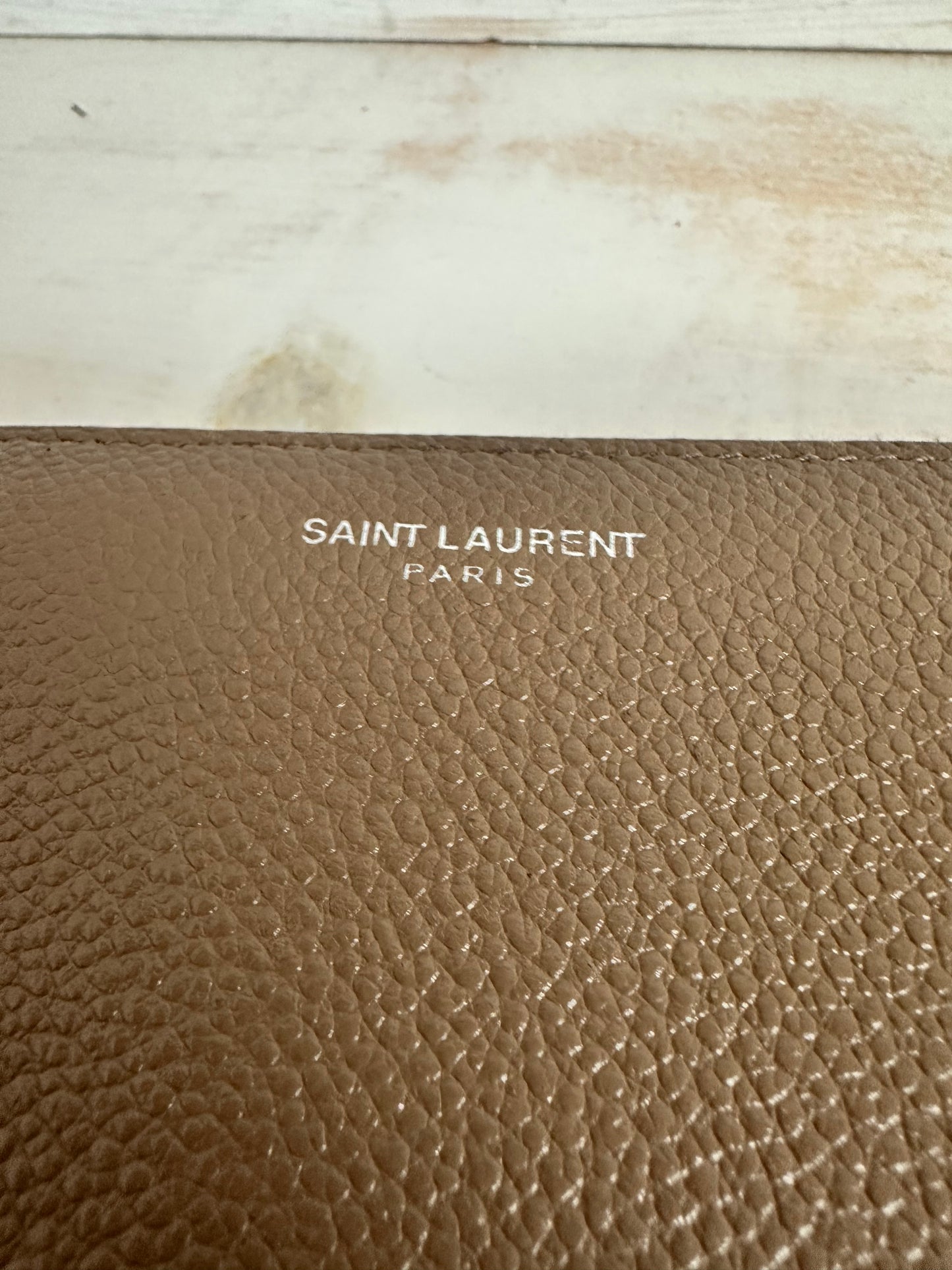 YVES SAINT LAURENT
Taupe Pebbled Leather Rive Gauche Zip Around Wallet