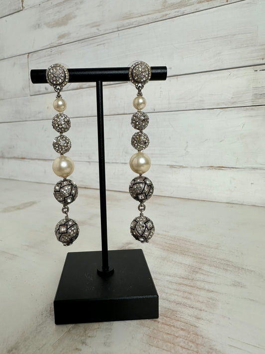 Chanel 2014C Silver toned and rhinestone dangle earrings adorned- pierced
